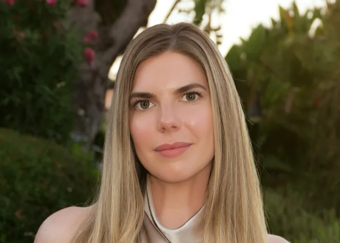Photograph of Samantha Jane Lever, head and shoulders, outdoors in a garden